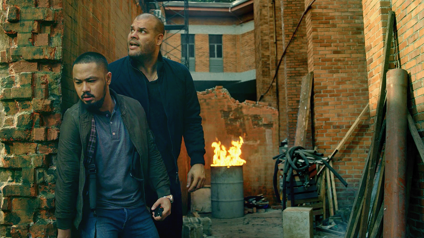 Sky Fiber video add snapshot of two men hiding behind a wall.